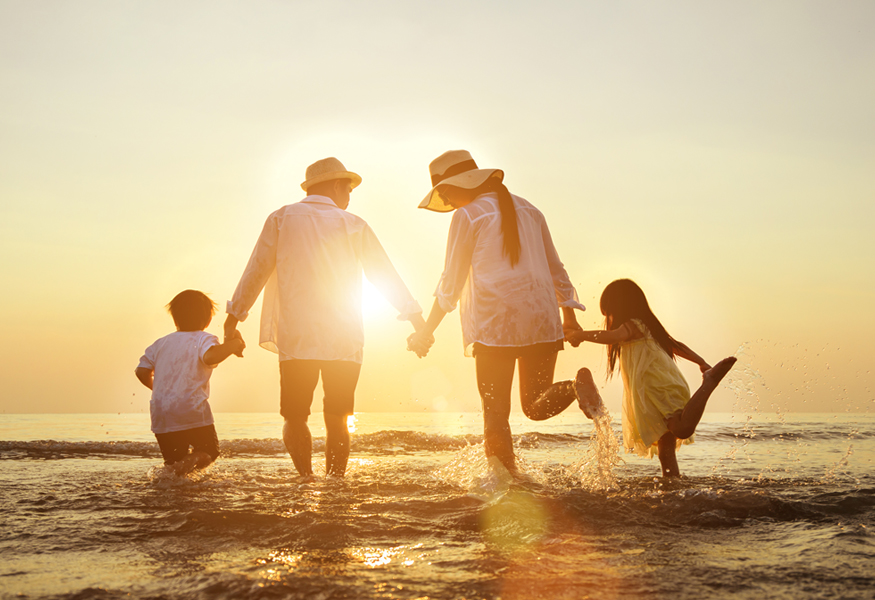 family-at-sunset-playing-on-water